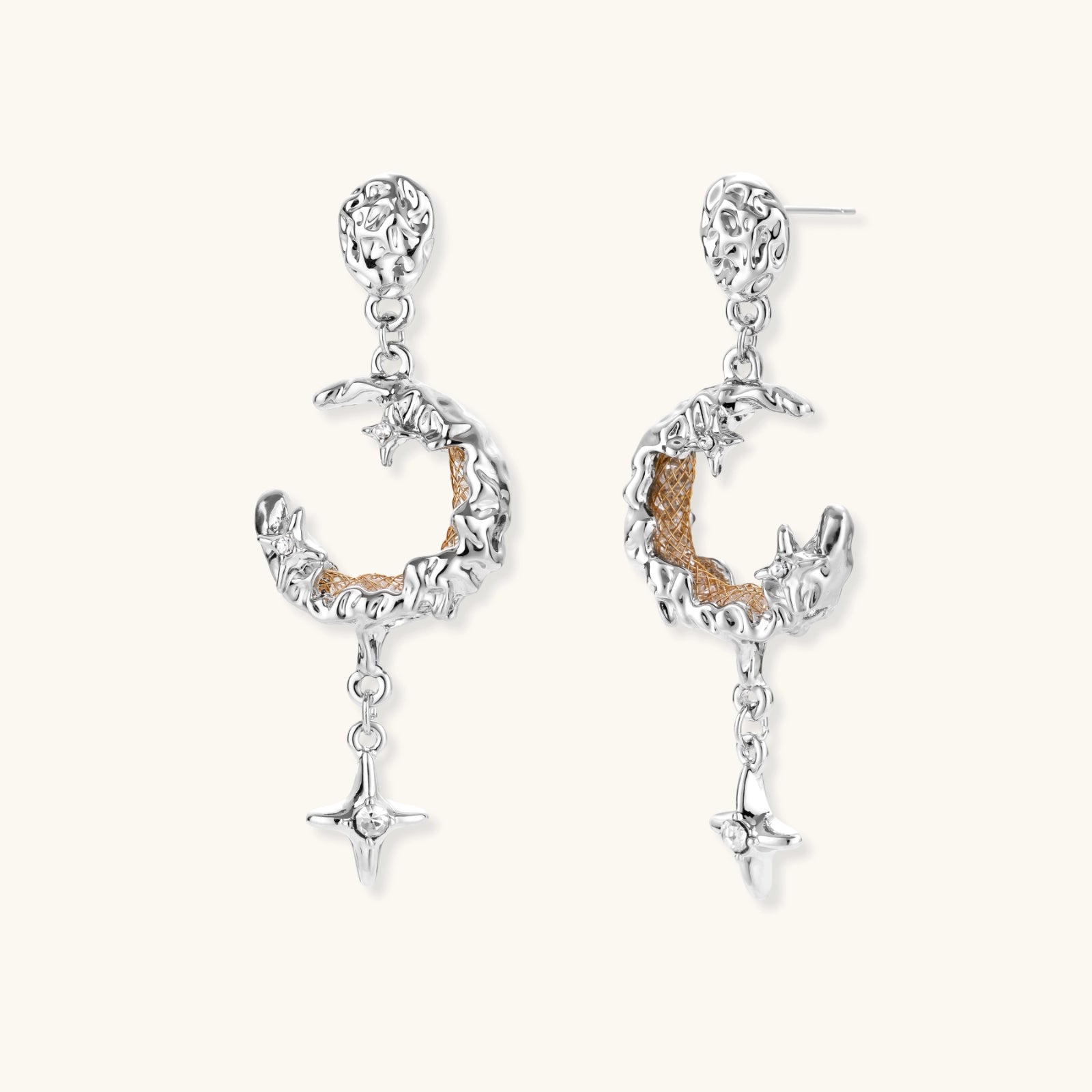 Detailed eco-brass dangle earrings featuring crescent moons with gold rope details and dangling star charms on white background.